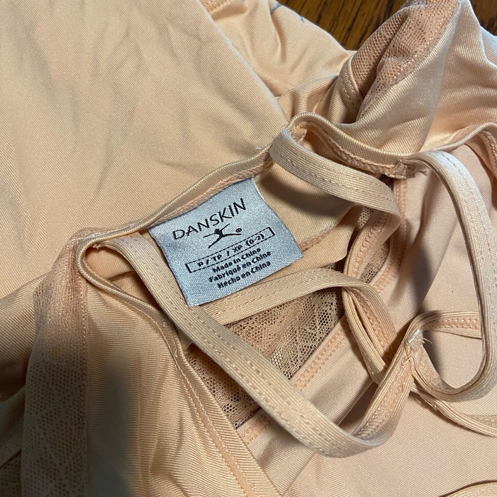 Danskin blush pink leotard with cutouts. Size XS / S